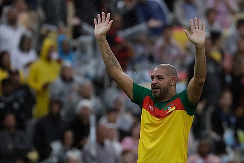 Adriano celebrates scoring a goal